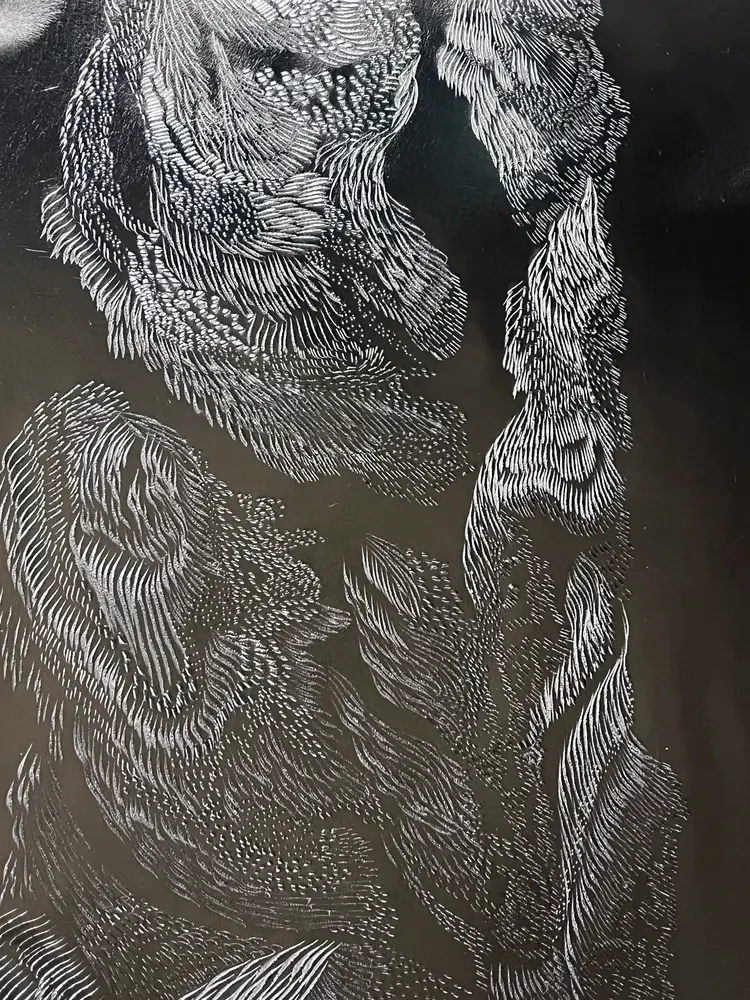 Resilience — butterfly wing engraved into recycled metal skin