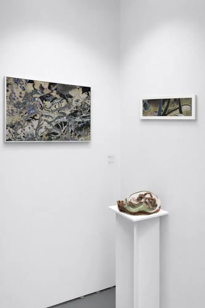 Art fair booth with tapestry paintings and glass cocoon sculpture, Miami 